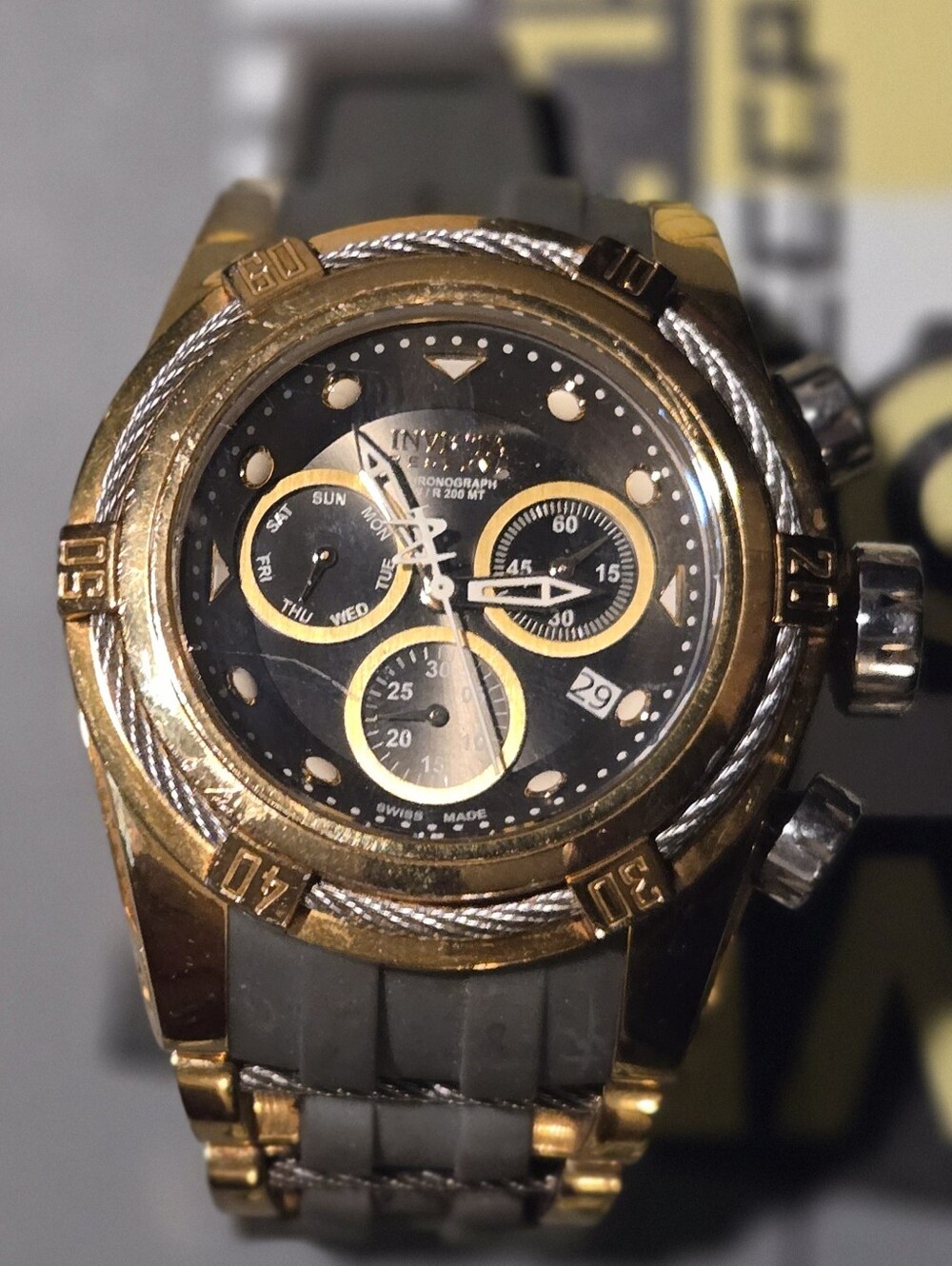 Invicta Gold and Black Chronograph Watch with Gray Strap